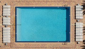 Pool in birds eye view by Mark den Hartog