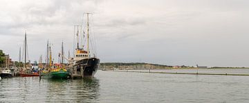 Historic tugboat Holland in Terschelling harbour. by Roel Ovinge