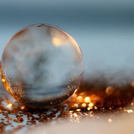 Sunset caught in a drop of water by Kvinne Fotografie