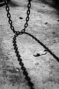 Iron chain in an abandoned factory with shadow by Elles Rijsdijk thumbnail