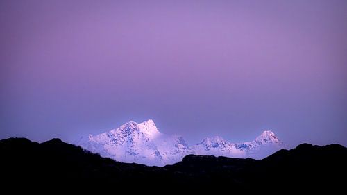 Snow on the mountains in the blue hour of day by Nando Harmsen