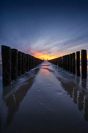 Wave breaker during sunset in Zeeland by Thom Brouwer