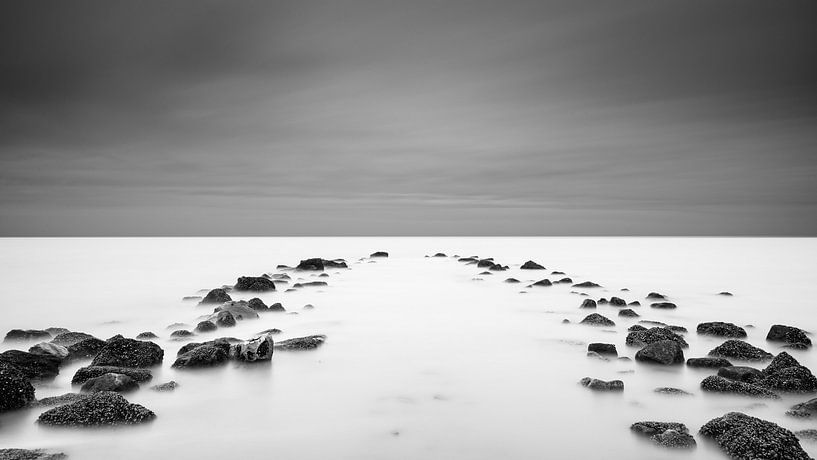 Felsen eines Wellenbrechers von KC Photography