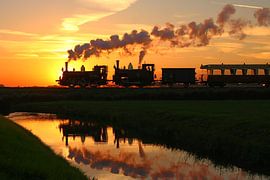 Steam tram with setting sun by Richard Krol