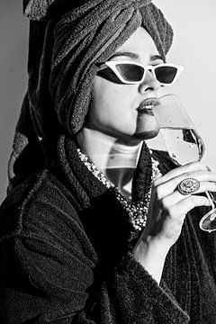 Audrey Hepburn Style modern portrait, woman with towel around her headand champagne