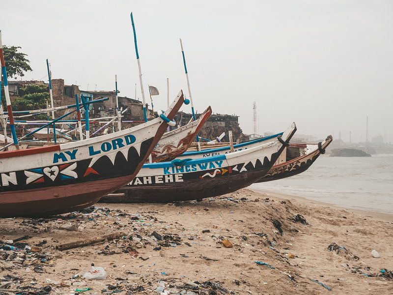 Traditional wooden boats on the beach of Jamestown in Accra, Ghana by Michiel Dros