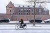 Winters Kasteel Woerden met fietser op de voorgrond van John Verbruggen thumbnail