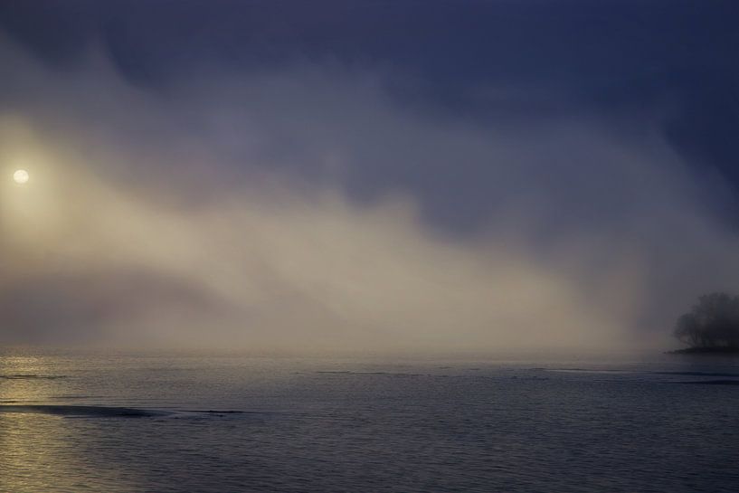 Sunrise fog above lake by Jan Brons