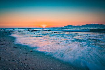 Sunset with waves on the beach of Kos by Marcus Beckert