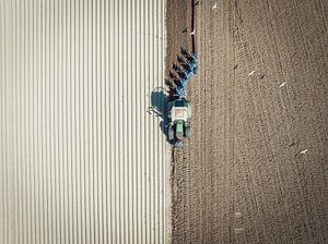 Tractor preparing the soil for planting crops