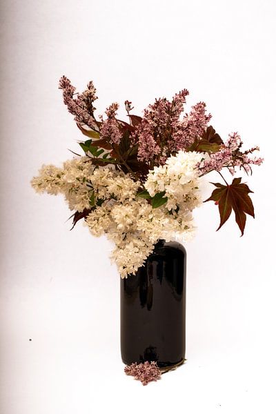 bunch of pink and white lilacs in blue vase by Aan Kant