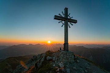Sunrise over the Tannheim mountains with summit cross by Leo Schindzielorz