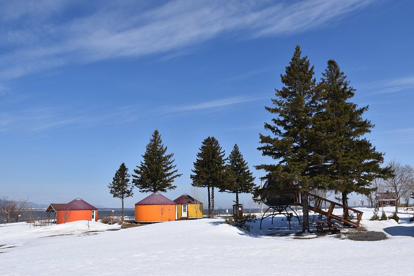 Camping in winter under blue skies by Claude Laprise