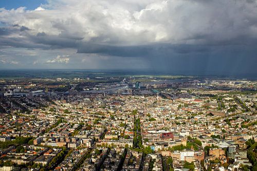 A rainstorm hangs over Amsterdam's canal belt