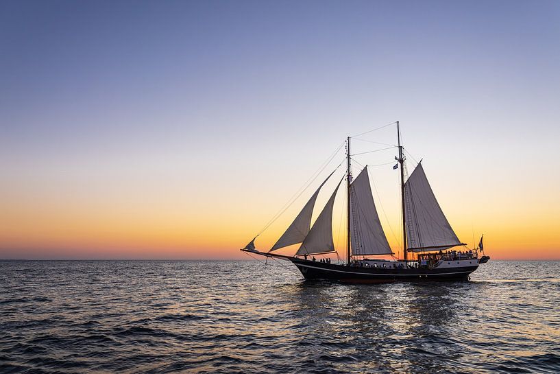 Sailing ship in the sunset at the Hanse Sail in Rostock by Rico Ködder