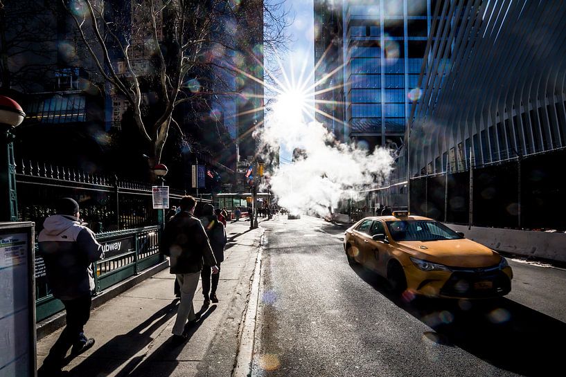street in New York with steam and sunlight by Eric van Nieuwland