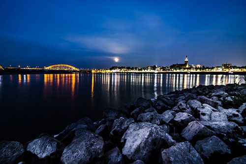 skyline of Nijmegen seen from the waal beach at Lent during the night