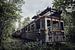 Train urbex abandonné au milieu des bois. sur Steven Dijkshoorn