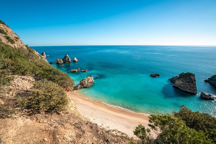 Portuguese beach with turquoise blue sea by Leo Schindzielorz