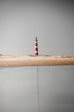 The lighthouse of beautiful Ameland in reflection by Graphx