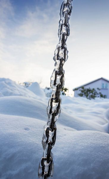 Frozen chain in front of snow pile by Besa Art
