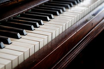 antique wooden piano keyboard, music concept, selected focus and shallow depth of field by Maren Winter
