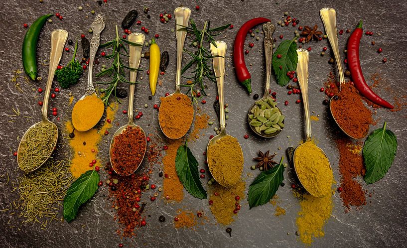 Spices on silver spoon with various herbs by Hans-Bernd Lichtblau