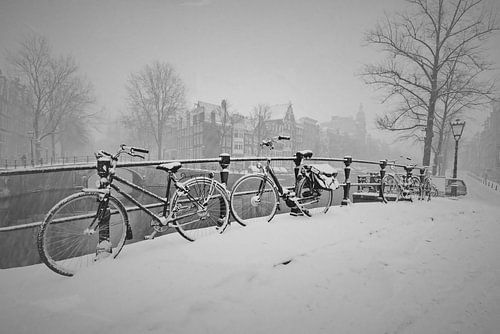 Old retro photo of Amsterdam in the snow in winter
