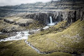 Icelandic Waterfall Carving Through Misty Cliffs by Patrick Kilb