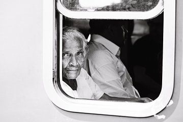 The beautiful Sri Lankan woman in a blue train by Rebecca Gruppen
