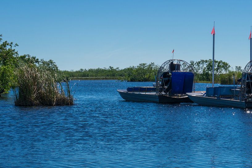 USA, Florida, Two airboats with huge propellers in the water in the everglades by adventure-photos