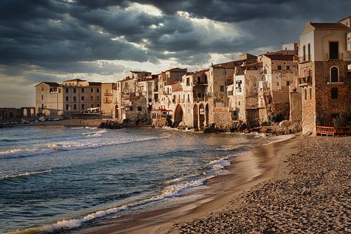 Cefalù town on Sicily under dark clouds by iPics Photography