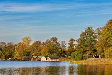 View over house lake to boathouses in town Feldberg by Rico Ködder