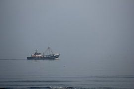 A fishing boat on the still sea by PO Fotografie