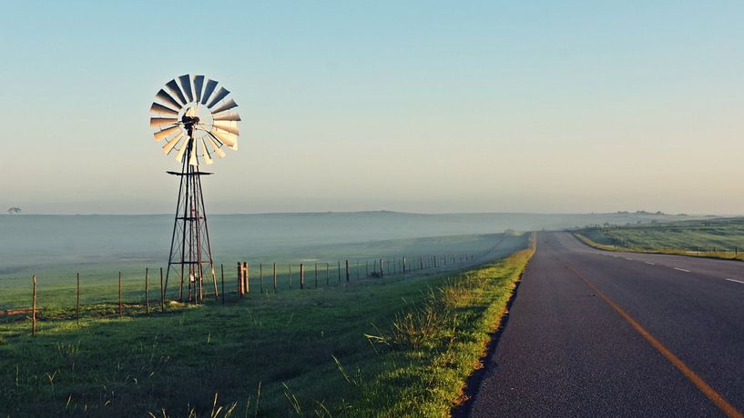 Water pumps wind turbine in morning light by Werner Lehmann