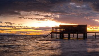 Maison de bain au coucher du soleil