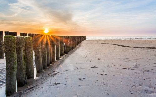 Sunset on the beach by Peter van Rooij