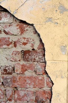dilapidated peeling plaster on a facade by Heiko Kueverling