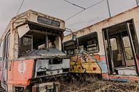 Connected in Oblivion: Abandoned Trams Connected Together on Railway Line