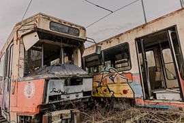Connected in Oblivion: Abandoned Trams Connected Together on Railway Line by Melvin Meijer