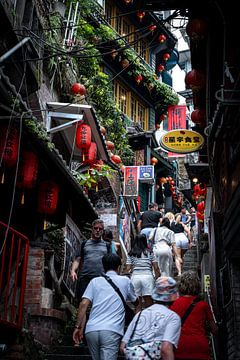 The busy street of the village of Jiufen in Taiwan by Mickéle Godderis