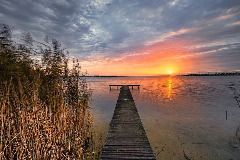 jetty in Den Oever at sunrise by peterheinspictures
