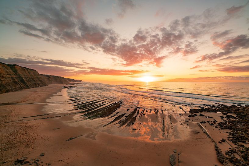 Sunset on the beach with cliffs by Leo Schindzielorz