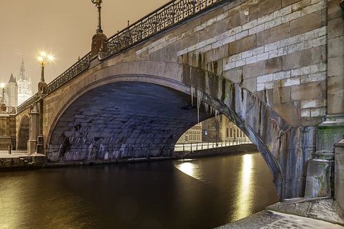 During snowfall at the Sint Baafsbrug see next to the Leie of Ghent