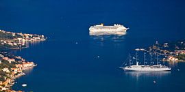 two ships in the bright blue sea and a little girl with red roofs. A beautiful cruise ship in the bl by Michael Semenov