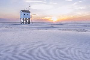 Chalet d'arrosage au coucher du soleil Vlieland