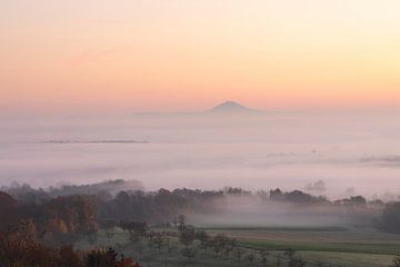 Hohenstaufen in a sea of fog with delicate colours at sunrise.