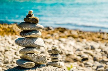 Stonebalance with pebbles at the shore of the lake of constance by Dieter Walther