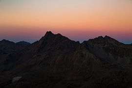 Fairy-tale sunset over lonely mountain peaks in the Austrian Alps by Hidde Hageman
