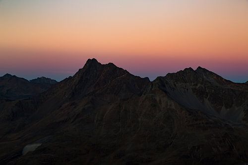 Fairy-tale sunset over lonely mountain peaks in the Austrian Alps